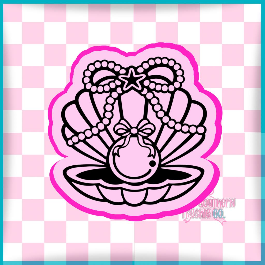 Pearl in seashell with pearl bow