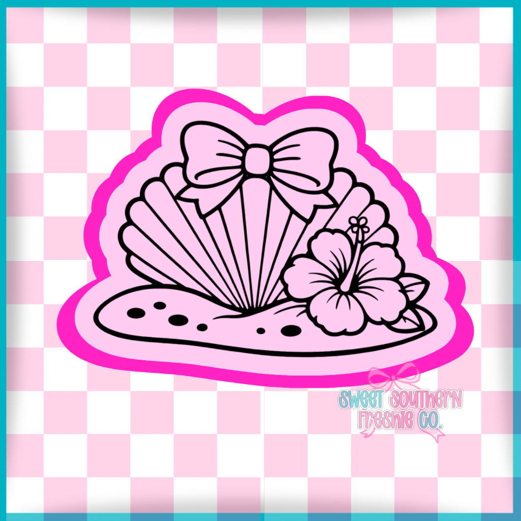 Seashell with sand bow and hibiscus