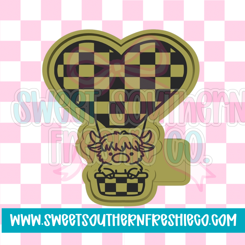 Highland cow in Checkered air balloon