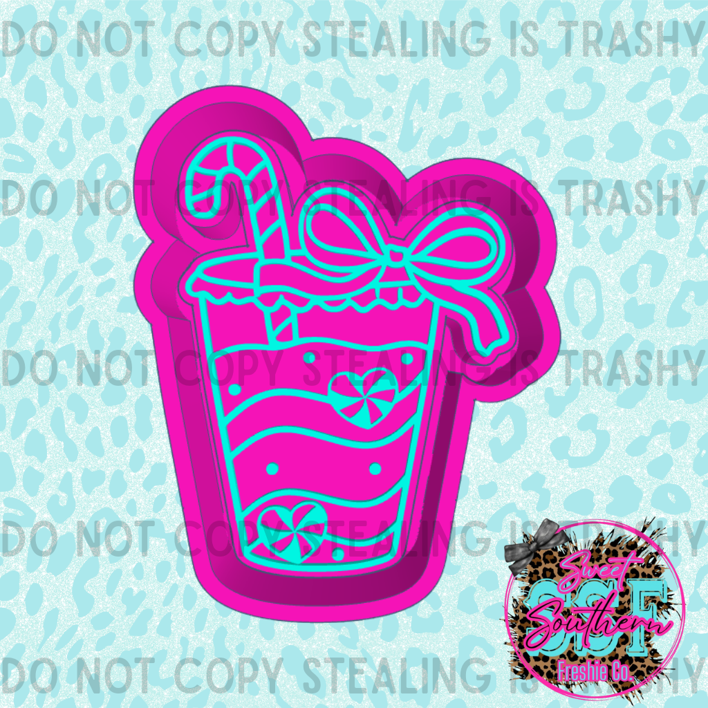 Cup with peppermint hearts and candy cane with bow